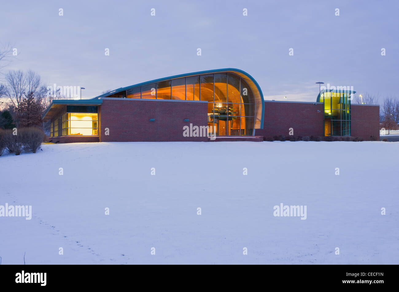 Inver Glen Public Library Exterior At Sunrise With Interior Illuminated